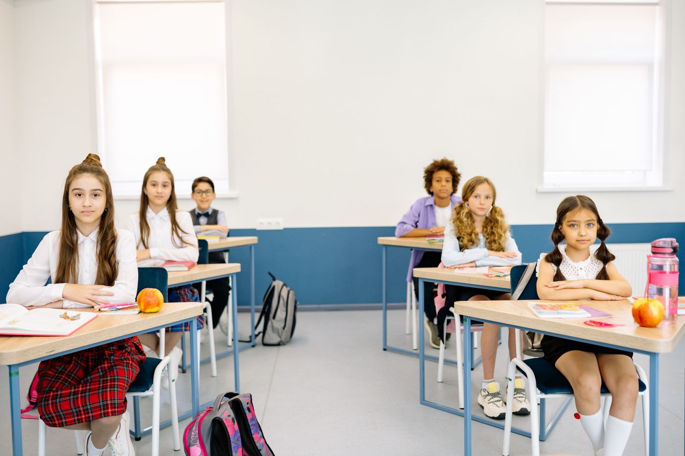 Students in a bright classroom during a lesson.